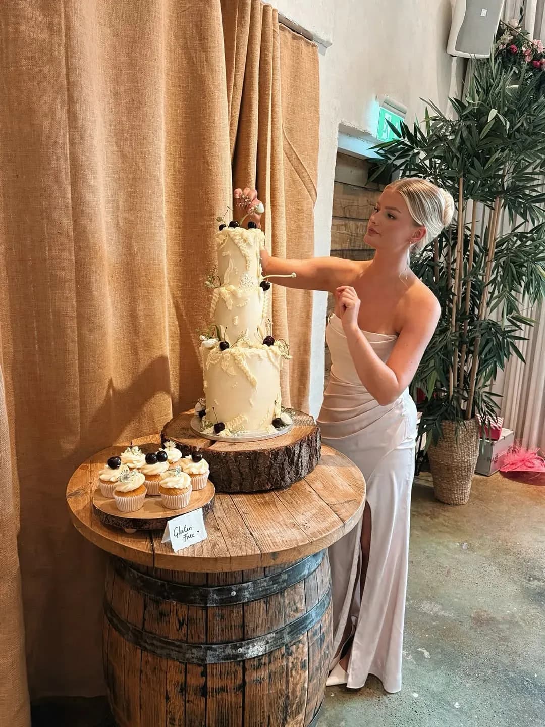Beth styling a tiered wedding cake