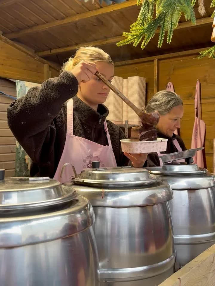 Beth pouring hot chocolate at the Christmas market