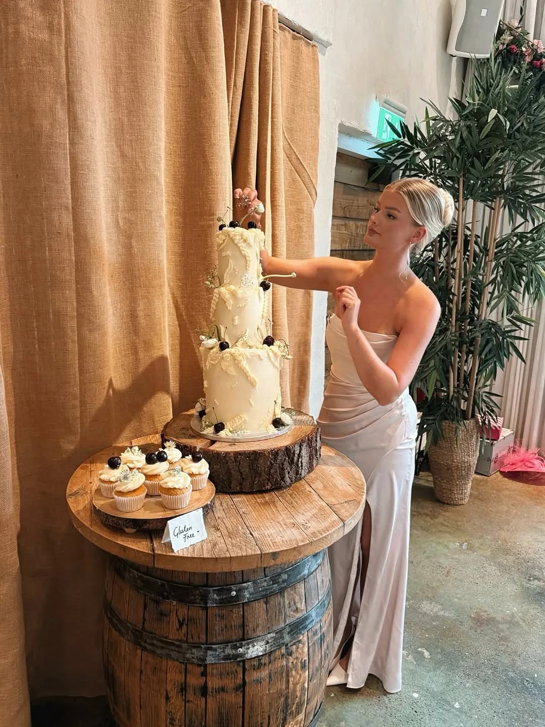 Beth styling a tiered wedding cake
